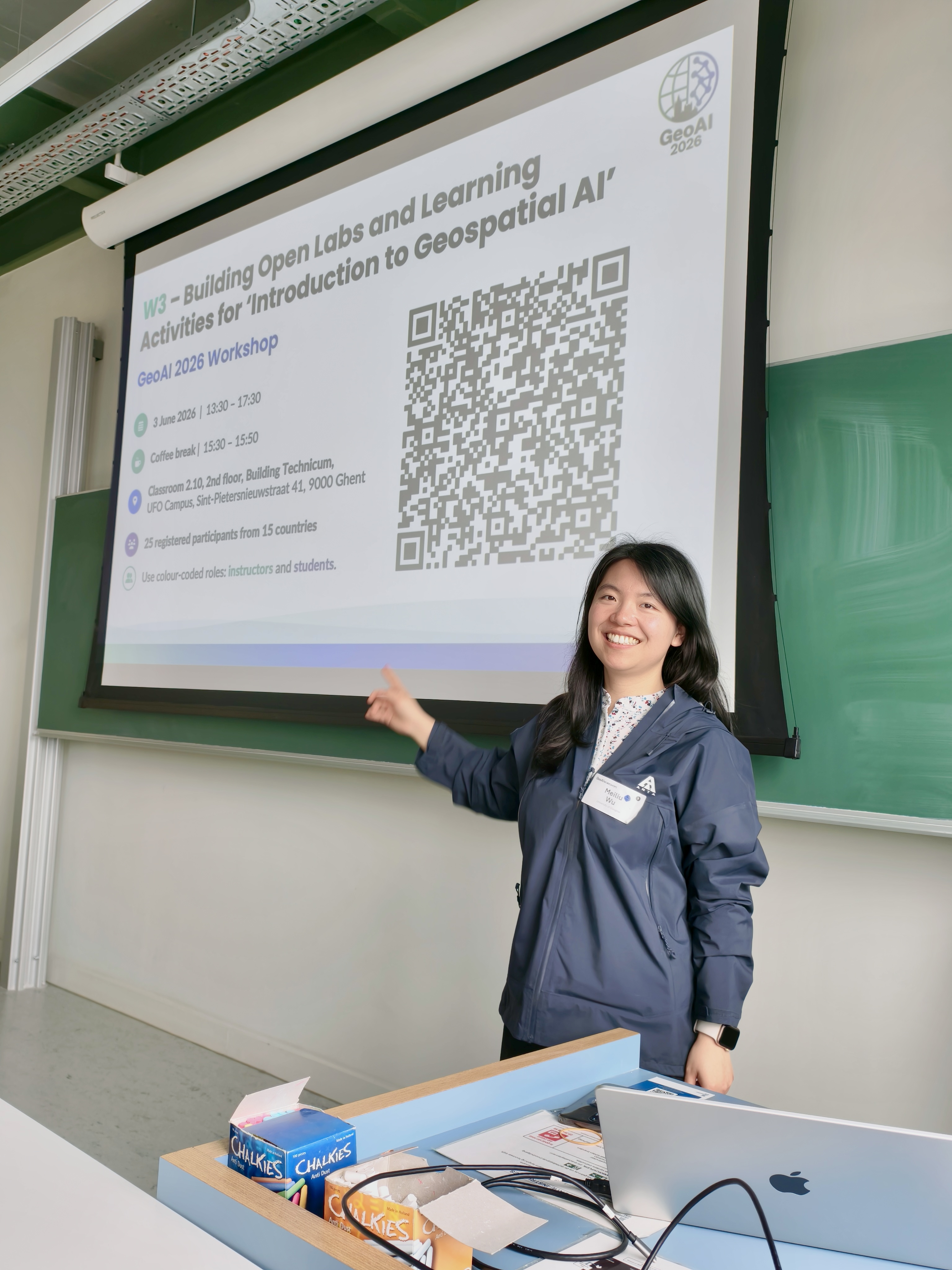 Meiliu beside the opening slide for Building Open Labs and Learning Activities for Introduction to Geospatial AI