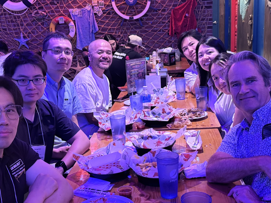 Colleagues gathered around a restaurant table during the Maryland trip