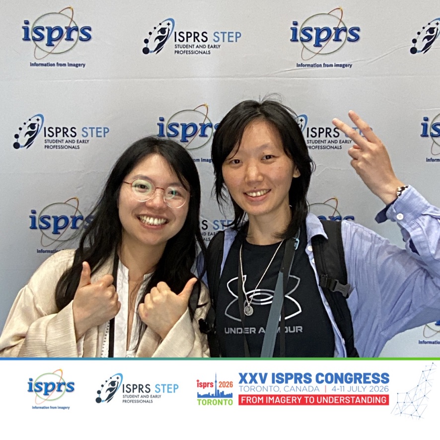 A photograph at the ISPRS Congress backdrop